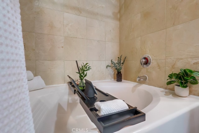 488 E Ocean Blvd Unit 502, Long Beach, CA 90802 - bathroom featuring tile walls and a tub to relax in