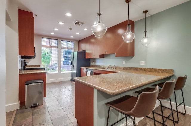 488 E Ocean Blvd Unit 502, Long Beach, CA 90802 - kitchen with recessed lighting, dishwasher, a peninsula, a breakfast bar area, and hanging light fixtures