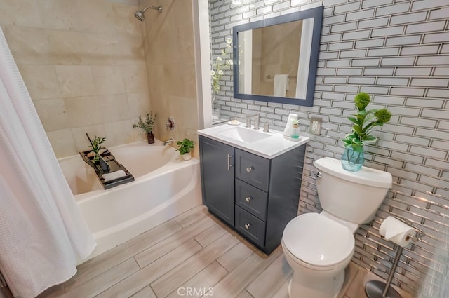 488 E Ocean Blvd Unit 502, Long Beach, CA 90802 - bathroom with shower / bath combo, vanity, and tile walls