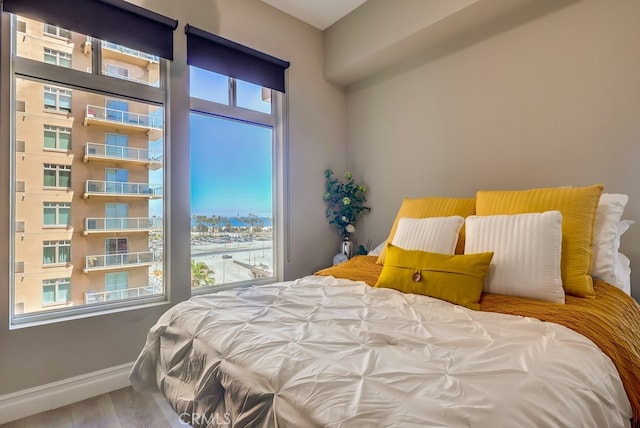 488 E Ocean Blvd Unit 502, Long Beach, CA 90802 - bedroom with multiple windows and wood finished floors