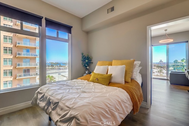 488 E Ocean Blvd Unit 502, Long Beach, CA 90802 - bedroom featuring wood finished floors and baseboards