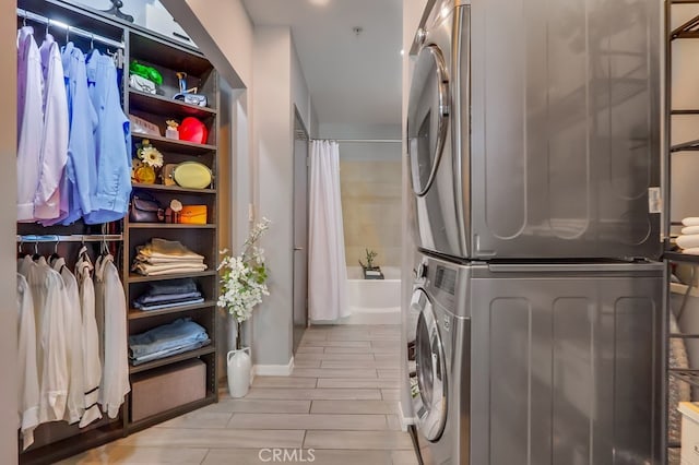 488 E Ocean Blvd Unit 502, Long Beach, CA 90802 - washroom with estacked washer and dryer and wood finish floors
