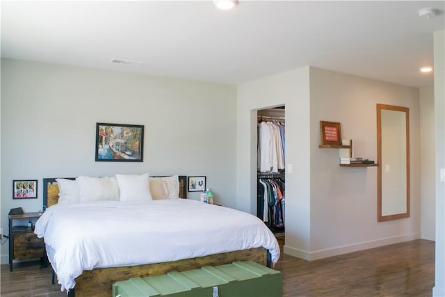 542 N Kilkea Dr, Los Angeles, CA 90048 - bedroom with wood finished floors, a walk in closet, recessed lighting, and a closet