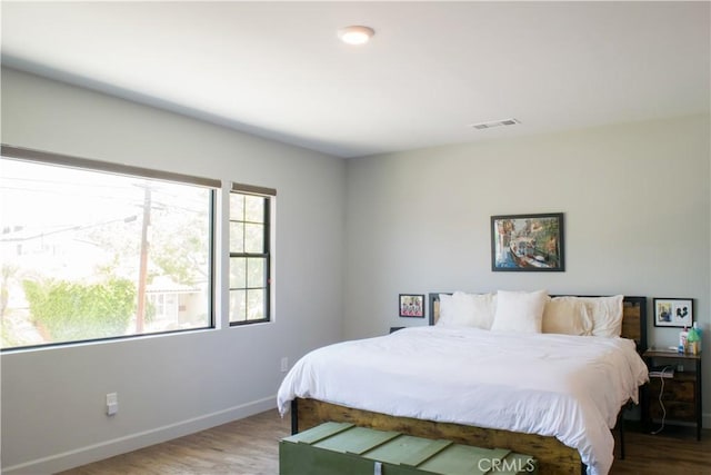 542 N Kilkea Dr, Los Angeles, CA 90048 - bedroom featuring baseboards and wood finished floors