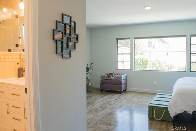 542 N Kilkea Dr, Los Angeles, CA 90048 - bedroom with wood finished floors and ensuite bathroom