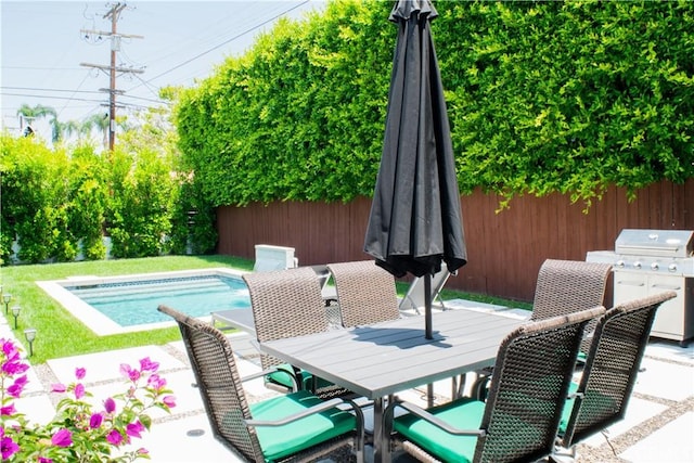 542 N Kilkea Dr, Los Angeles, CA 90048 - fenced backyard with a grill and outdoor dining area