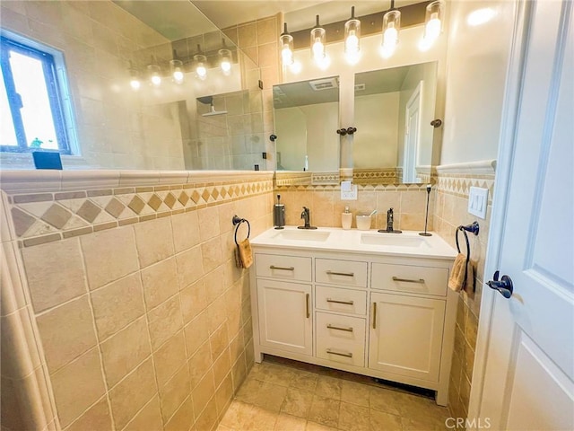 542 N Kilkea Dr, Los Angeles, CA 90048 - full bath featuring tile walls, double vanity, and a walk in shower
