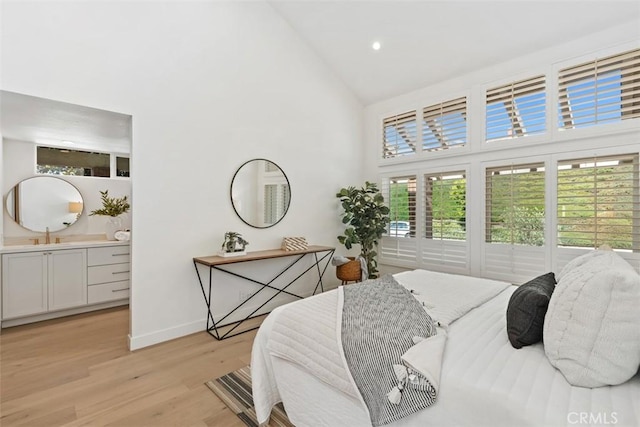 317 Calle Familia, San Clemente, CA 92672 - bedroom featuring high vaulted ceiling, light wood-type flooring, ensuite bathroom, and recessed lighting