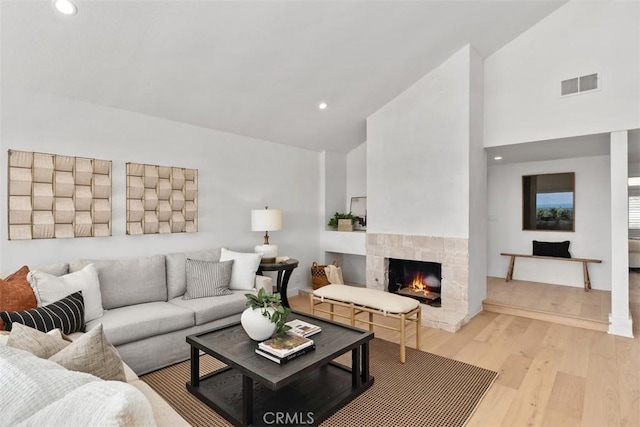 317 Calle Familia, San Clemente, CA 92672 - living room with light wood finished floors, high vaulted ceiling, a fireplace, and recessed lighting