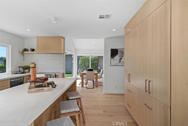 317 Calle Familia, San Clemente, CA 92672 - kitchen with a breakfast bar, open shelves, stainless steel dishwasher, modern cabinets, and recessed lighting