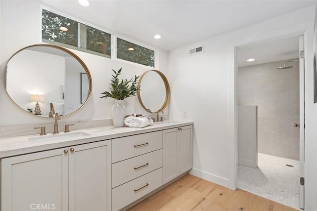 317 Calle Familia, San Clemente, CA 92672 - full bath featuring double vanity, walk in shower, wood finished floors, and recessed lighting