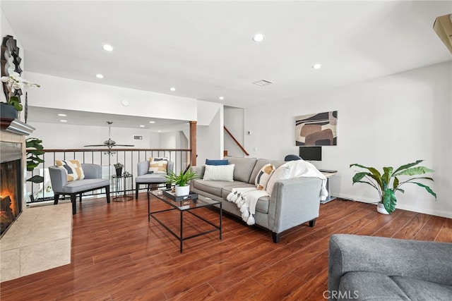 1737 Peyton Ave Unit E, Burbank, CA 91504 - living area with a ceiling fan, a tile fireplace, wood finished floors, recessed lighting, and stairs