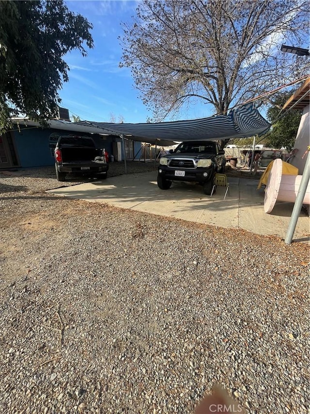 4153 N Webster Ave, Perris, CA 92571 - view of parking / parking lot with a carport and driveway