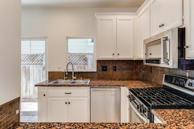558 Adina Way, Nipomo, CA 93444 - kitchen featuring appliances with stainless steel finishes, white cabinets, decorative backsplash, and dark stone countertops