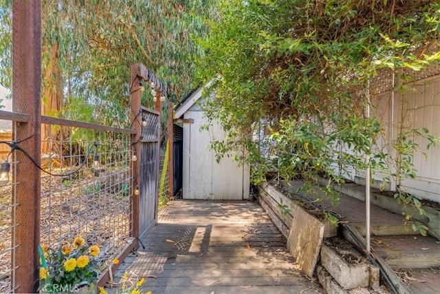 558 Adina Way, Nipomo, CA 93444 - fenced backyard with a deck and a storage unit