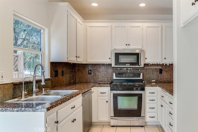 558 Adina Way, Nipomo, CA 93444 - kitchen with stainless steel appliances, white cabinetry, decorative backsplash, light tile patterned floors, and recessed lighting