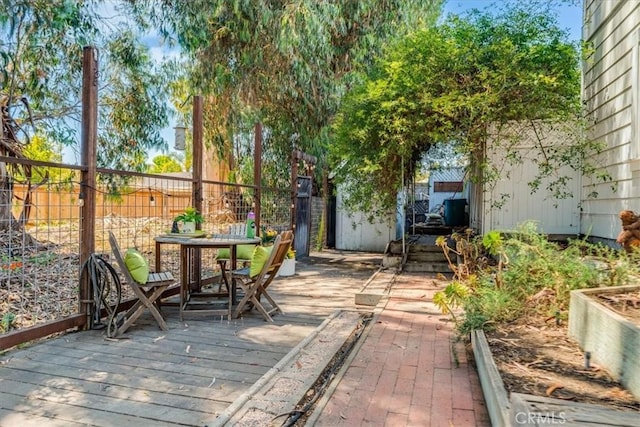 558 Adina Way, Nipomo, CA 93444 - fenced backyard with a wooden deck and outdoor dining area