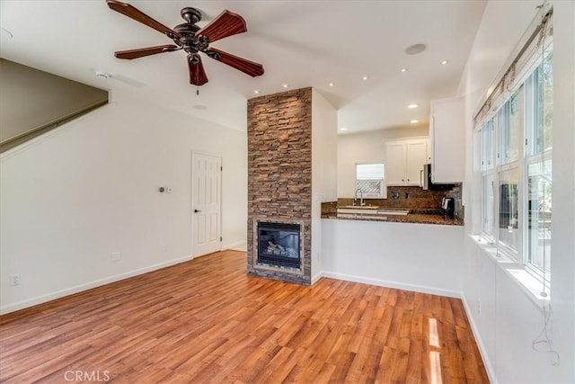 558 Adina Way, Nipomo, CA 93444 - unfurnished living room featuring ceiling fan, light wood-type flooring, a stone fireplace, and recessed lighting