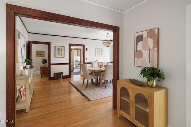 1036 N Chester Ave, Pasadena, CA 91104 - corridor with light wood-type flooring and ornamental molding