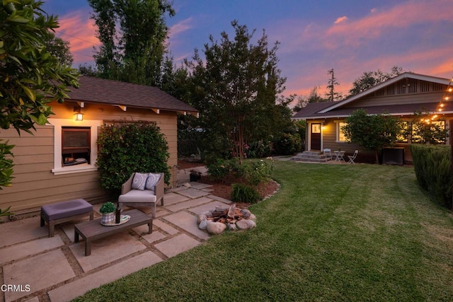 1036 N Chester Ave, Pasadena, CA 91104 - yard at dusk featuring a patio area, a yard, and an outdoor living space with a fire pit