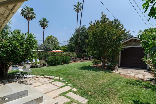 1036 N Chester Ave, Pasadena, CA 91104 - view of green lawn featuring a patio area and an outbuilding