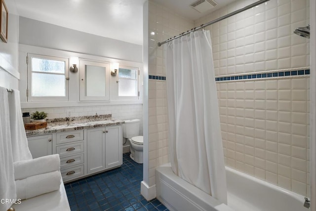 1036 N Chester Ave, Pasadena, CA 91104 - full bath featuring vanity, tile patterned flooring, shower / tub combo, and tile walls
