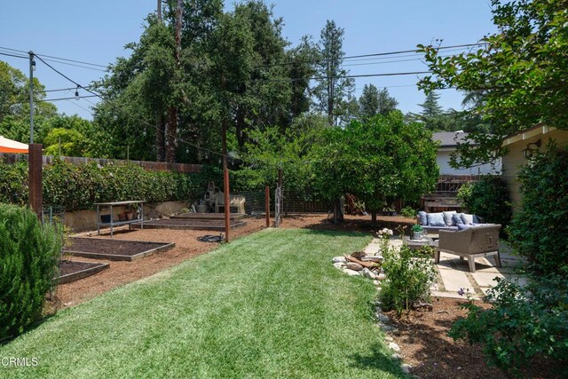 1036 N Chester Ave, Pasadena, CA 91104 - fenced backyard with a vegetable garden, a patio area, and an outdoor living space