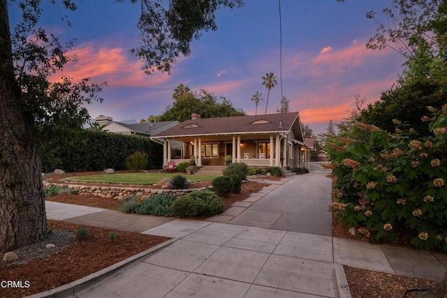 1036 N Chester Ave, Pasadena, CA 91104 - view of front of home with a porch, a gate, and driveway