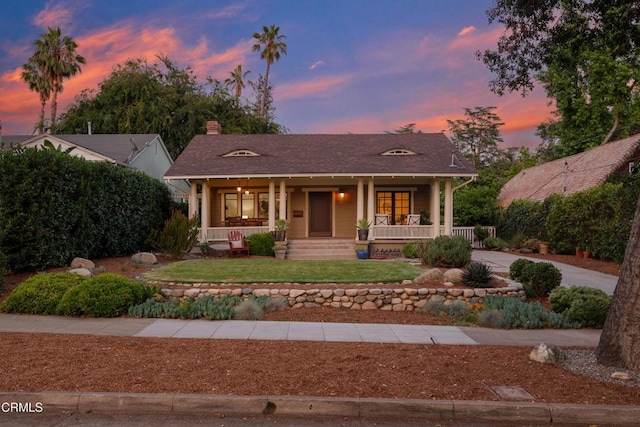 1036 N Chester Ave, Pasadena, CA 91104 - ranch-style home with covered porch, a chimney, and a front lawn