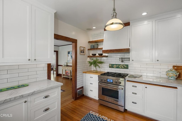 1036 N Chester Ave, Pasadena, CA 91104 - kitchen featuring stainless steel stove, light wood finished floors, white cabinets, decorative backsplash, and recessed lighting