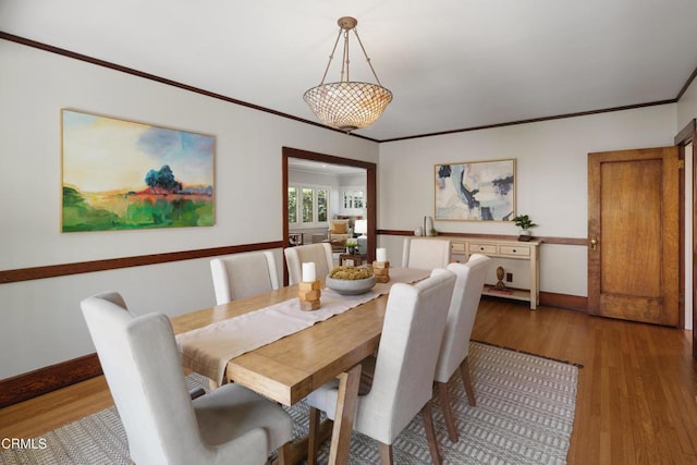 1036 N Chester Ave, Pasadena, CA 91104 - dining room featuring light wood-type flooring and crown molding
