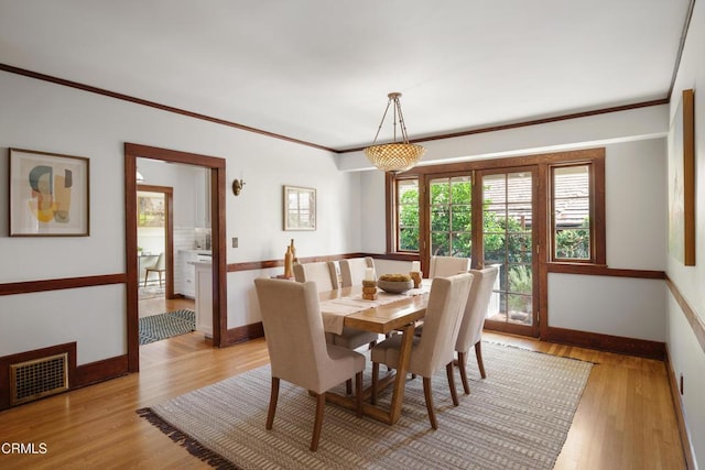 1036 N Chester Ave, Pasadena, CA 91104 - dining room with light wood finished floors and crown molding