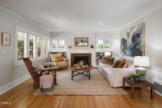 1036 N Chester Ave, Pasadena, CA 91104 - living area with ornamental molding, wood finished floors, a fireplace, and recessed lighting