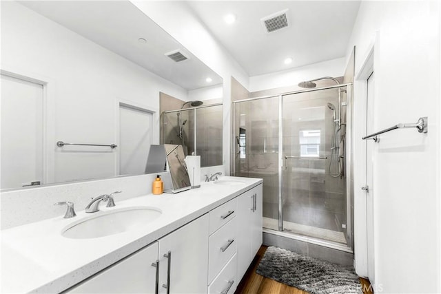 1206 W Cara Dr, Anaheim, CA 92805 - bathroom with a shower stall, double vanity, recessed lighting, and wood finished floors