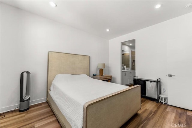 1206 W Cara Dr, Anaheim, CA 92805 - bedroom with wood finished floors, recessed lighting, and ensuite bathroom