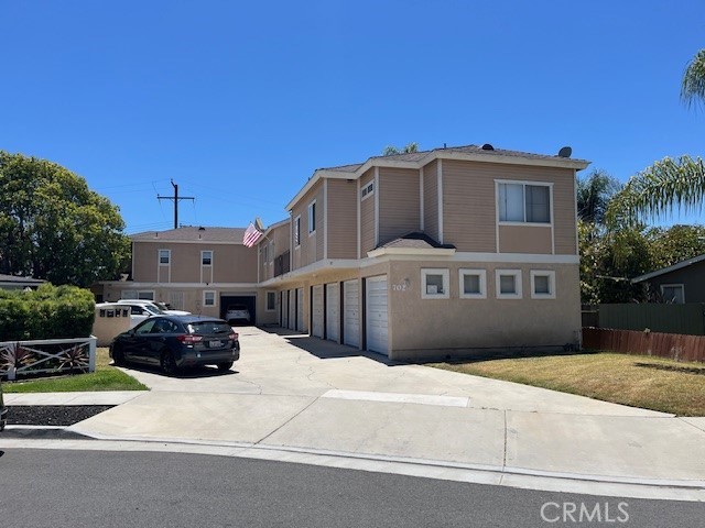 702 Jay Cir, Huntington Beach, CA 92648 - view of front of home with driveway and a garage