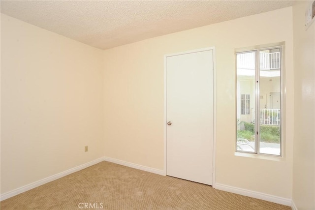 3342 Darby St Unit 317, Simi Valley, CA 93063 - empty room featuring light carpet and a textured ceiling