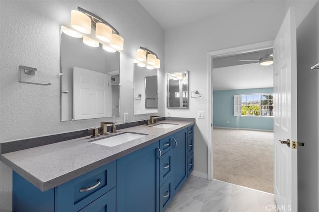 1307 W 7th St Unit 8, San Pedro, CA 90732 - bathroom featuring double vanity, marble finish floors, and ceiling fan