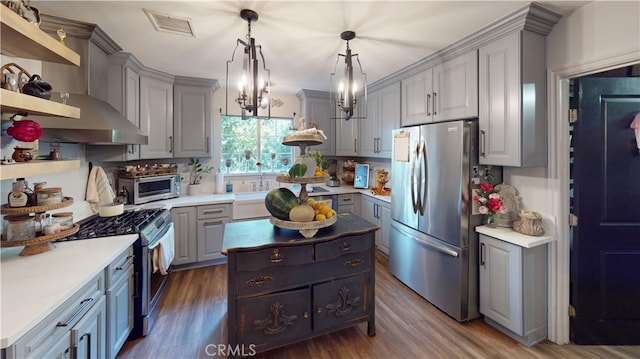 13260 Moreno Way, Moreno Valley, CA 92553 - kitchen with stainless steel appliances, gray cabinets, wall chimney exhaust hood, and a center island