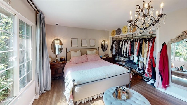 13260 Moreno Way, Moreno Valley, CA 92553 - bedroom with wood finished floors, a chandelier, and a closet