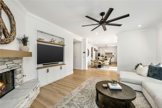 308 Via El Patio, San Clemente, CA 92673 - living room featuring a ceiling fan, light wood-style flooring, crown molding, recessed lighting, and a fireplace
