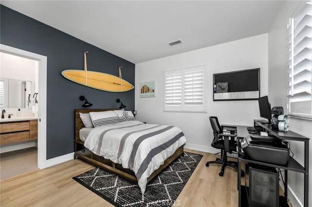 308 Via El Patio, San Clemente, CA 92673 - bedroom with wood finished floors, ensuite bath, and an office area
