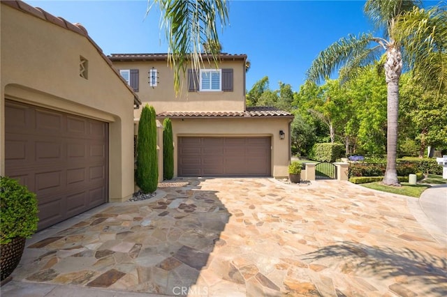 308 Via El Patio, San Clemente, CA 92673 - mediterranean / spanish-style home with stucco siding, a tiled roof, driveway, and a garage