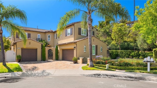 308 Via El Patio, San Clemente, CA 92673 - mediterranean / spanish-style home featuring a tile roof, stucco siding, driveway, a gate, and a garage
