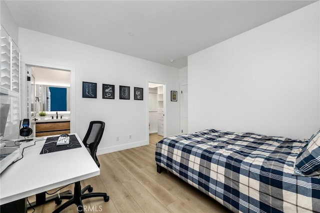 308 Via El Patio, San Clemente, CA 92673 - bedroom featuring light wood-style flooring, connected bathroom, and a desk