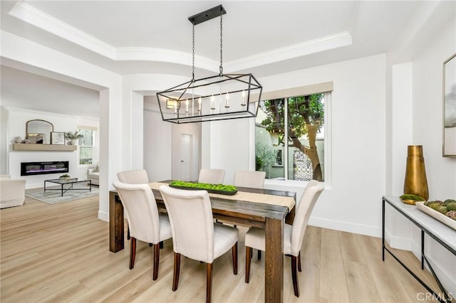 308 Via El Patio, San Clemente, CA 92673 - dining area featuring a chandelier, light wood finished floors, a tray ceiling, and ornamental molding