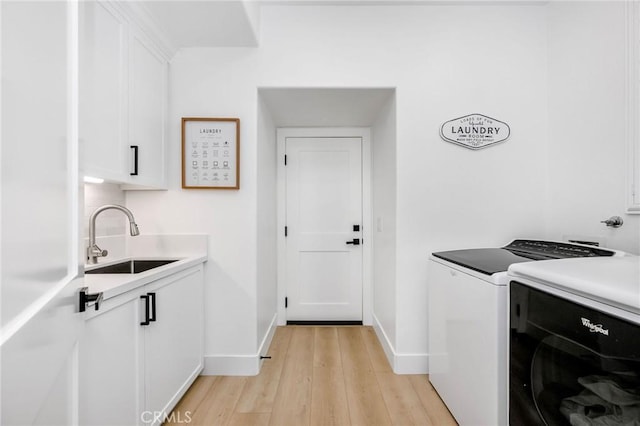 308 Via El Patio, San Clemente, CA 92673 - washroom with independent washer and dryer, cabinet space, and light wood-style floors