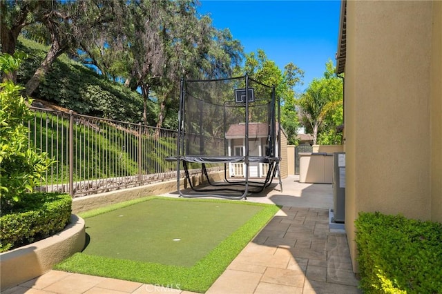 308 Via El Patio, San Clemente, CA 92673 - fenced backyard featuring a trampoline, a putting area, and a patio