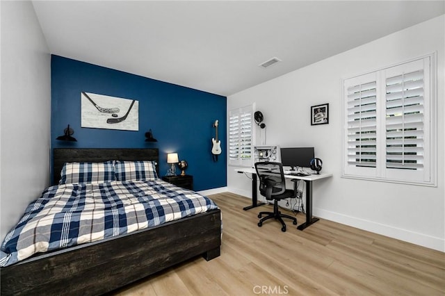 308 Via El Patio, San Clemente, CA 92673 - bedroom with wood finished floors, an office area, and an accent wall