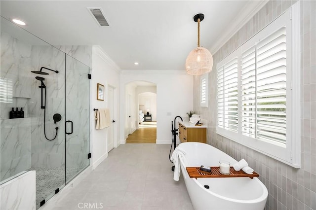 308 Via El Patio, San Clemente, CA 92673 - full bath featuring a marble finish shower, a freestanding tub, ornamental molding, recessed lighting, and tile walls
